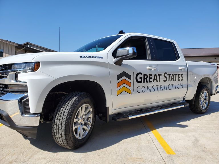 Service truck with custom graphic wrap created by Next Signs Fargo