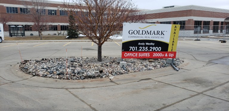 Large commercial for sale sign installed by Next Signs on property in Fargo ND