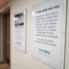 Full-color printed acrylic sign mounted on metal standoffs for interior wall display