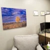 Frosted acrylic wall panel printed with company logo, installed using brushed stainless steel standoff hardware for a dimensional lobby sign display